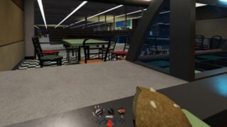 Screenshot from Darkest Hours, showing the POV of a character standing behind the counter in what appears to be a fast food shop. They are holding a burger in one hand. In the background, other players appear to be fighting a robotic monster. Screenshot from Darkest Hours, showing the POV of a character standing behind the counter in what appears to be a fast food shop. They are holding a burger in one hand. In the background, other players appear to be fighting a robotic monster.
