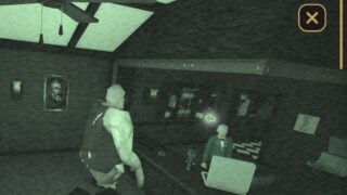 Screenshot from Hell Rails showing a view of the CCTV feed with nightvision turned on. It shows a hulking, ogre-like creature stood at the bar. 